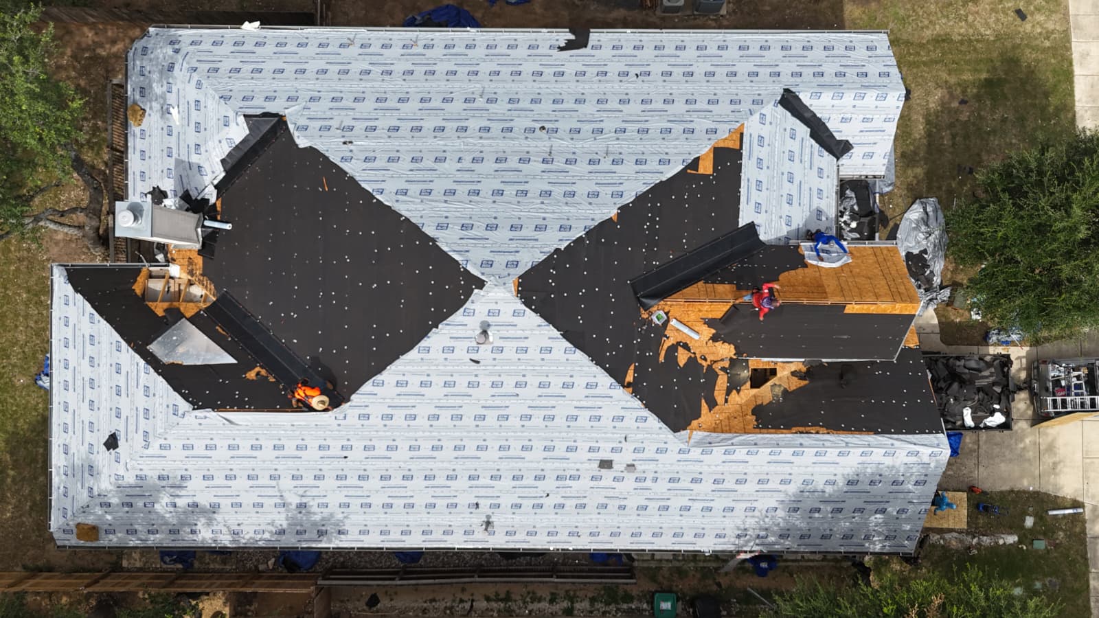 Drone view of a full roof replacement in progress